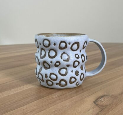 Wavy pastel blue mug, masked pattern