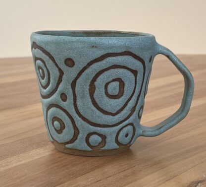 Turqouise mug, masked circles pattern