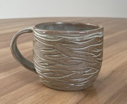 Mug with minty-green glaze and organic carvings (1)