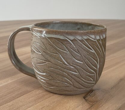 Mug with minty-green glaze and organic carvings (2)