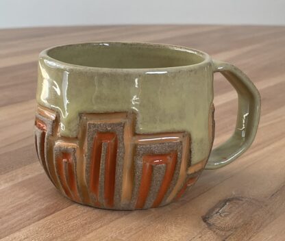 Geometrically carved mug - fire