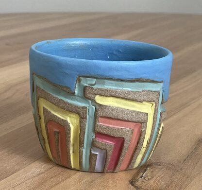 Colorful tumbler with geometric carvings