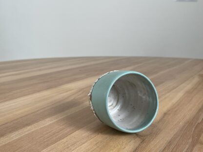 Light teal tumbler with a cloud-like belt - Image 4