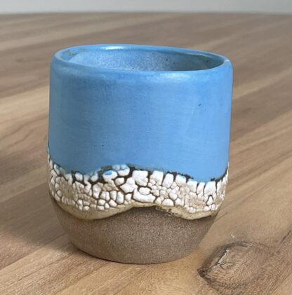 Blue tumbler with a cloud-like belt