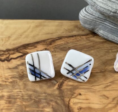 Blue square stick earrings with white gold stripes