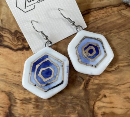 Blue hex inception earrings with white gold details