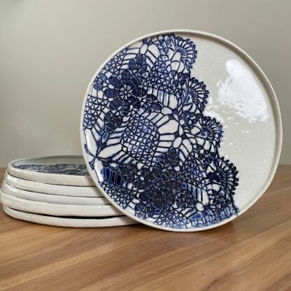 Porcelain dinner plate decorated with crocheted blue embossing