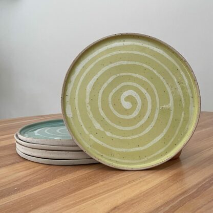 Yellow dinner plate with white spiral