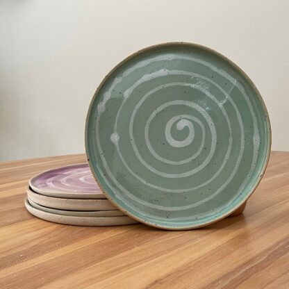 Green dinner plate with white spiral