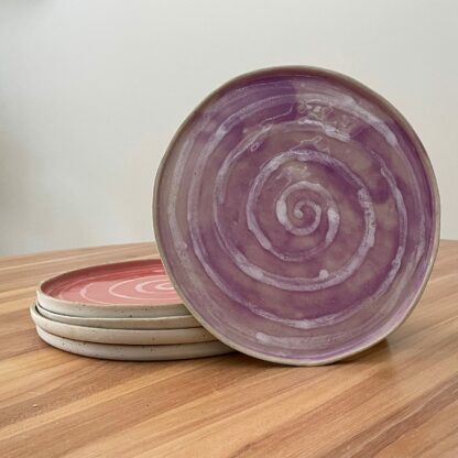 Purple dinner plate with white spiral