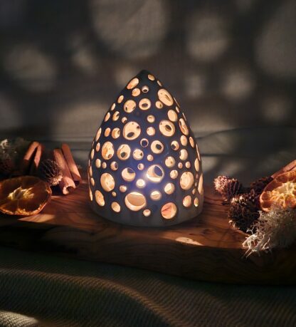 Openwork cone-shaped luminary