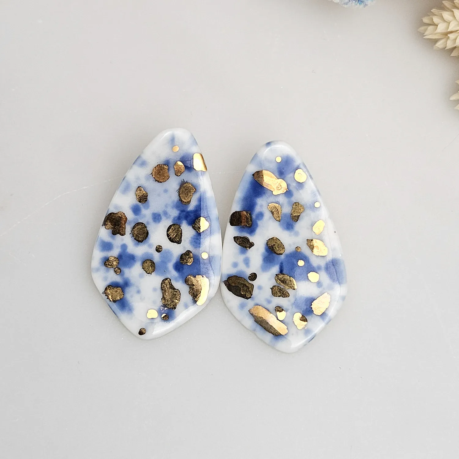 Porcelain stick-earrings - blue splash speckles with gold
