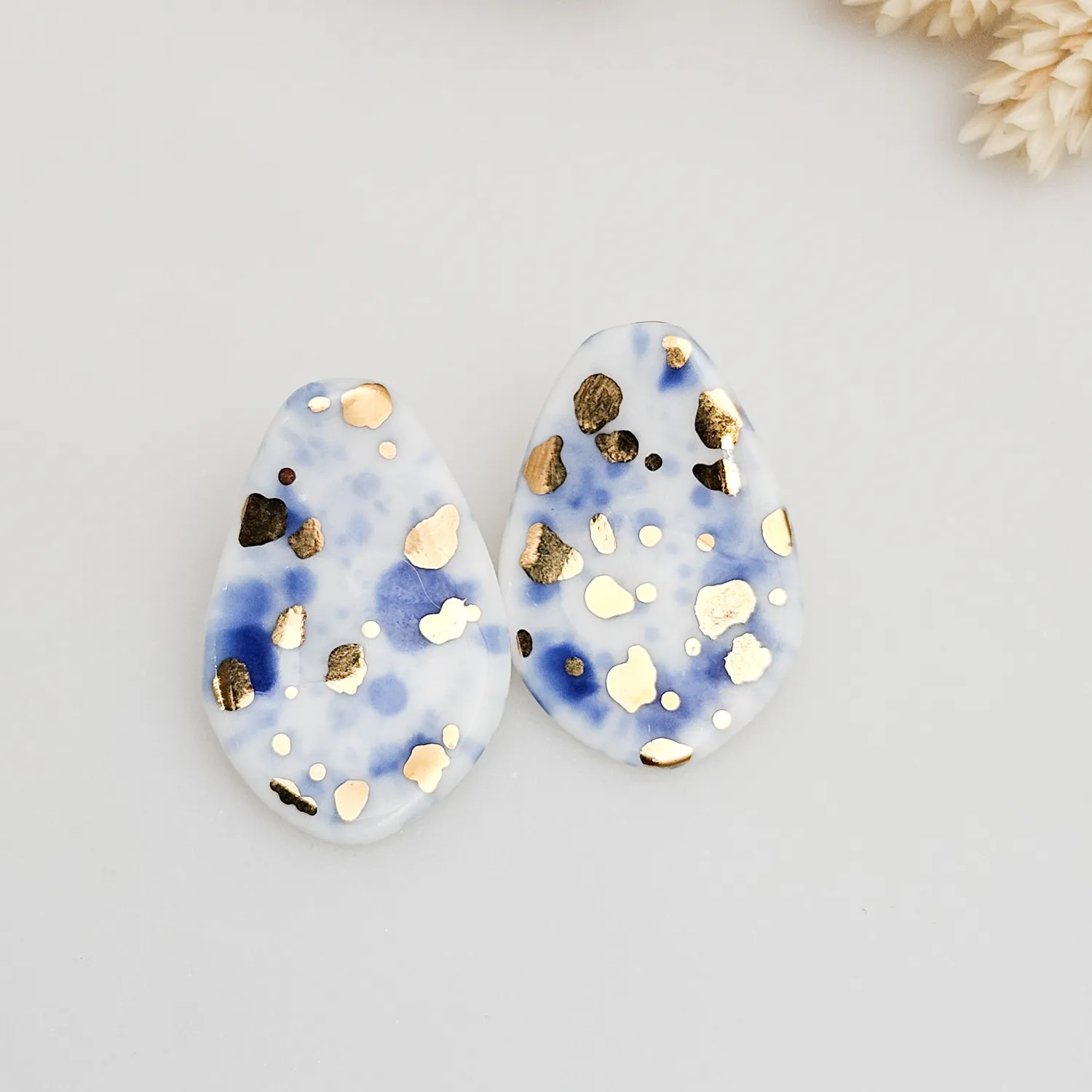 Porcelain stick-earrings - blue splash speckles with gold