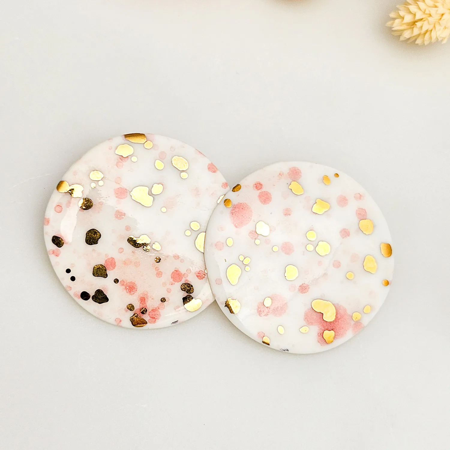 Round porcelain stick-earrings - pink splash speckles with gold