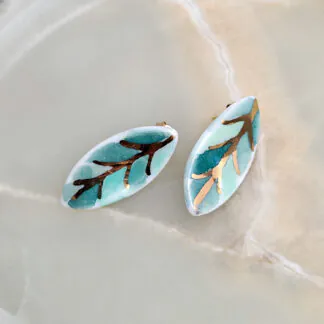 Porcelain stick-earrings - green leaf with gold