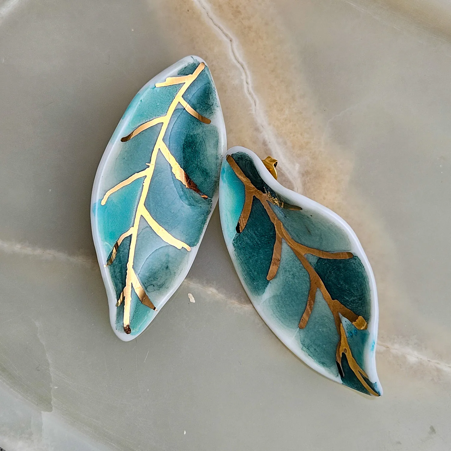 Porcelain stick-earrings - green leaf with gold