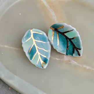 Porcelain stick-earrings - green leaf with gold