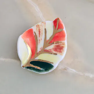 Porcelain brooch - autumn leaf with gold