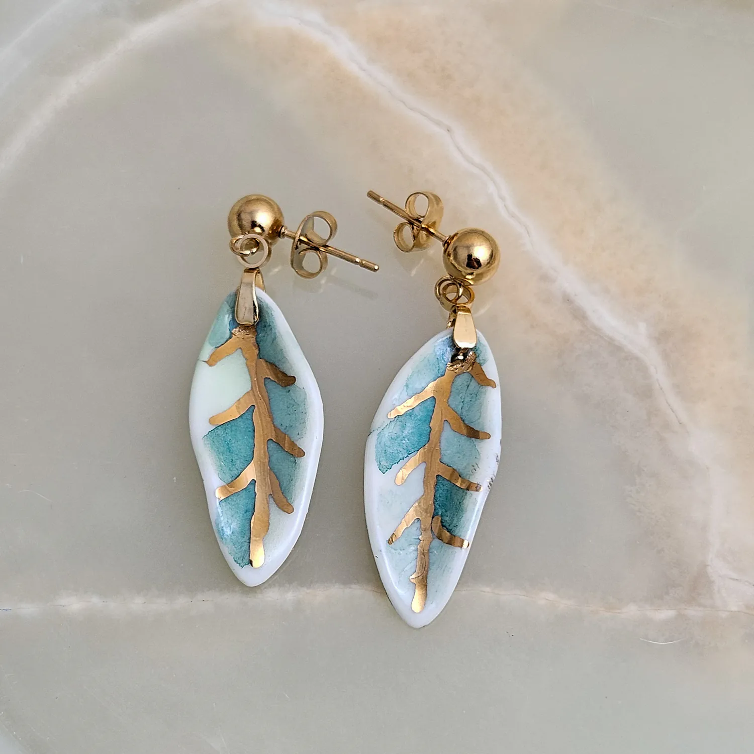 Hanging porcelain earrings - green leaf with gold