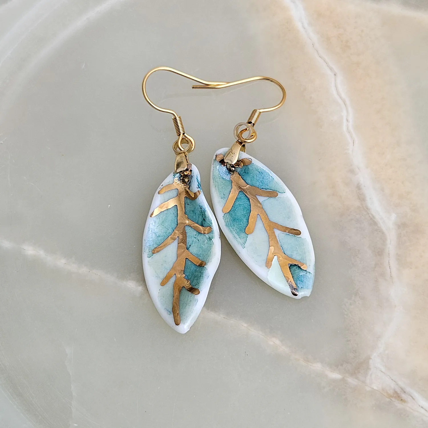 Hanging porcelain earrings - green leaf with gold