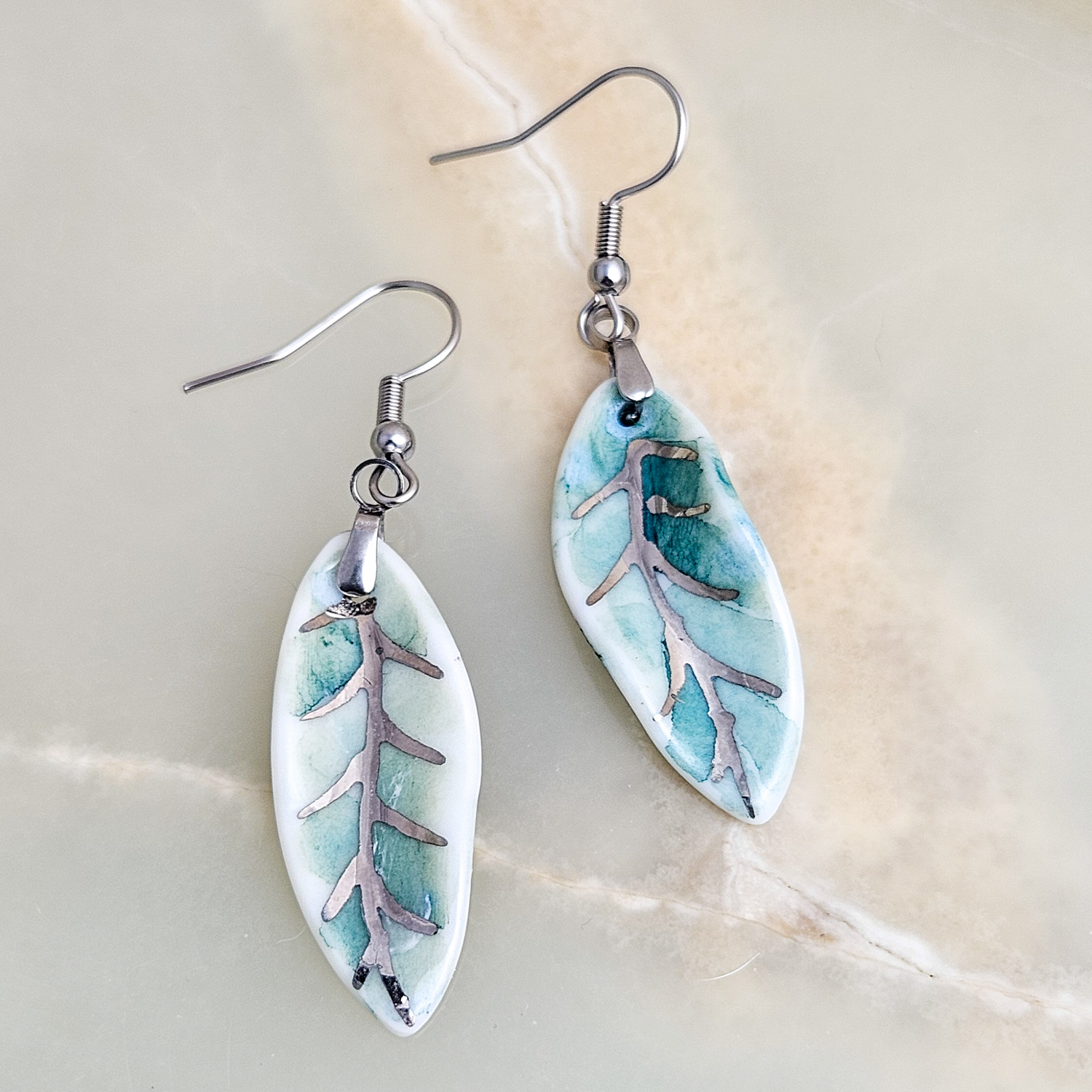 Dangle fine ceramic porcelain designer earrings - green leaf with silver accents (white gold)