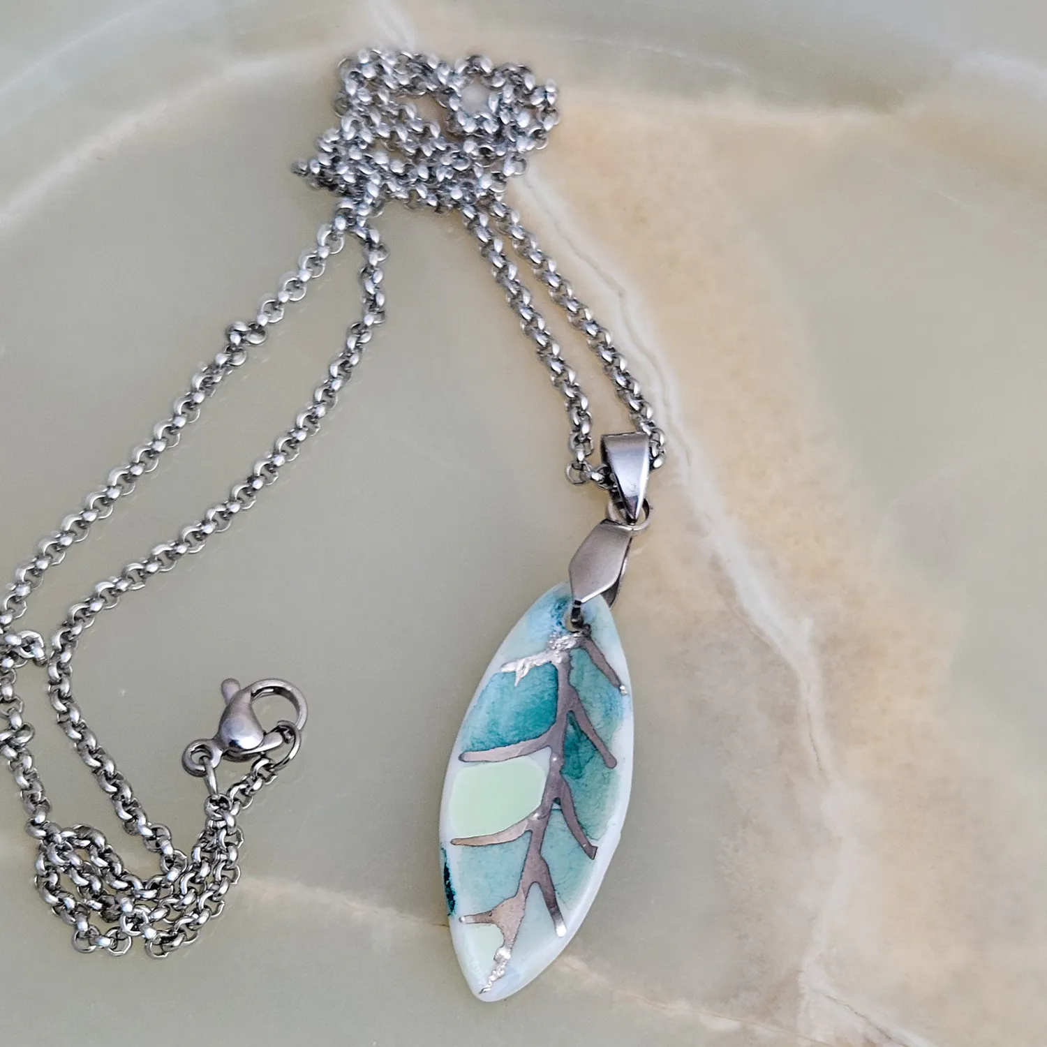 Fine ceramic fine ceramic porcelain designer necklace - green leaf with silver accents (white gold)