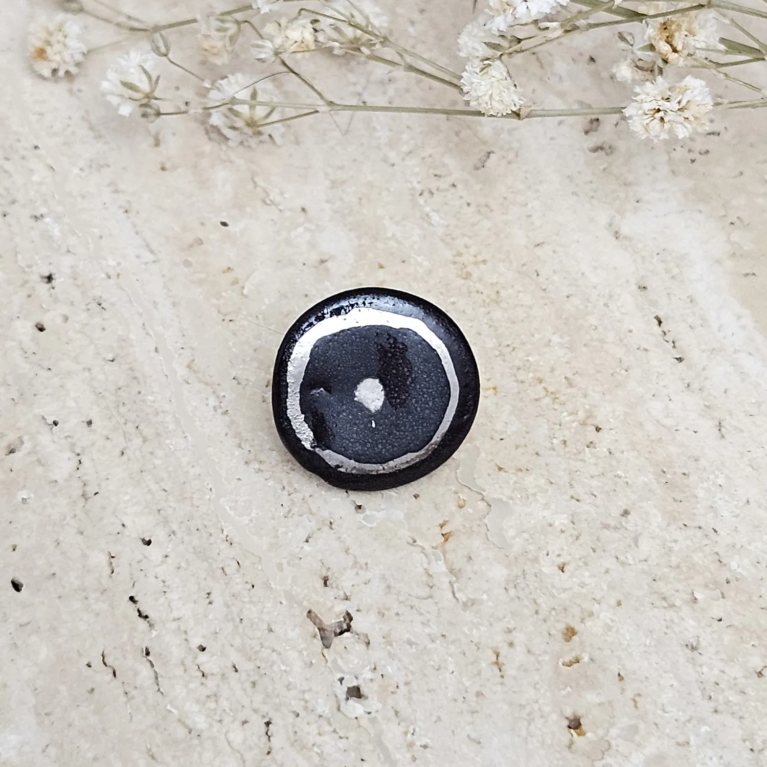 Black fine ceramic porcelain pin with silver accents (white gold)