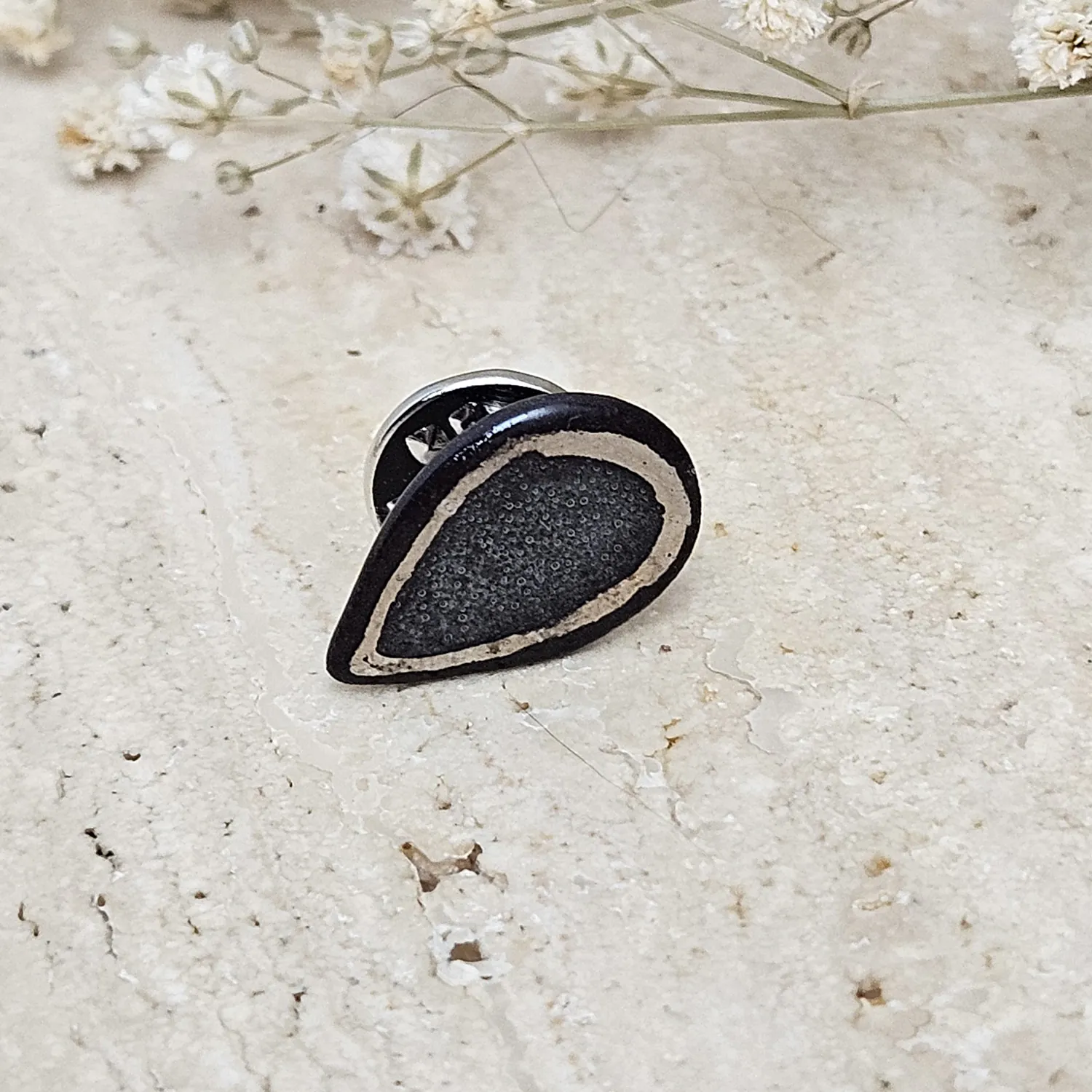Black fine ceramic porcelain pin with silver accents (white gold)