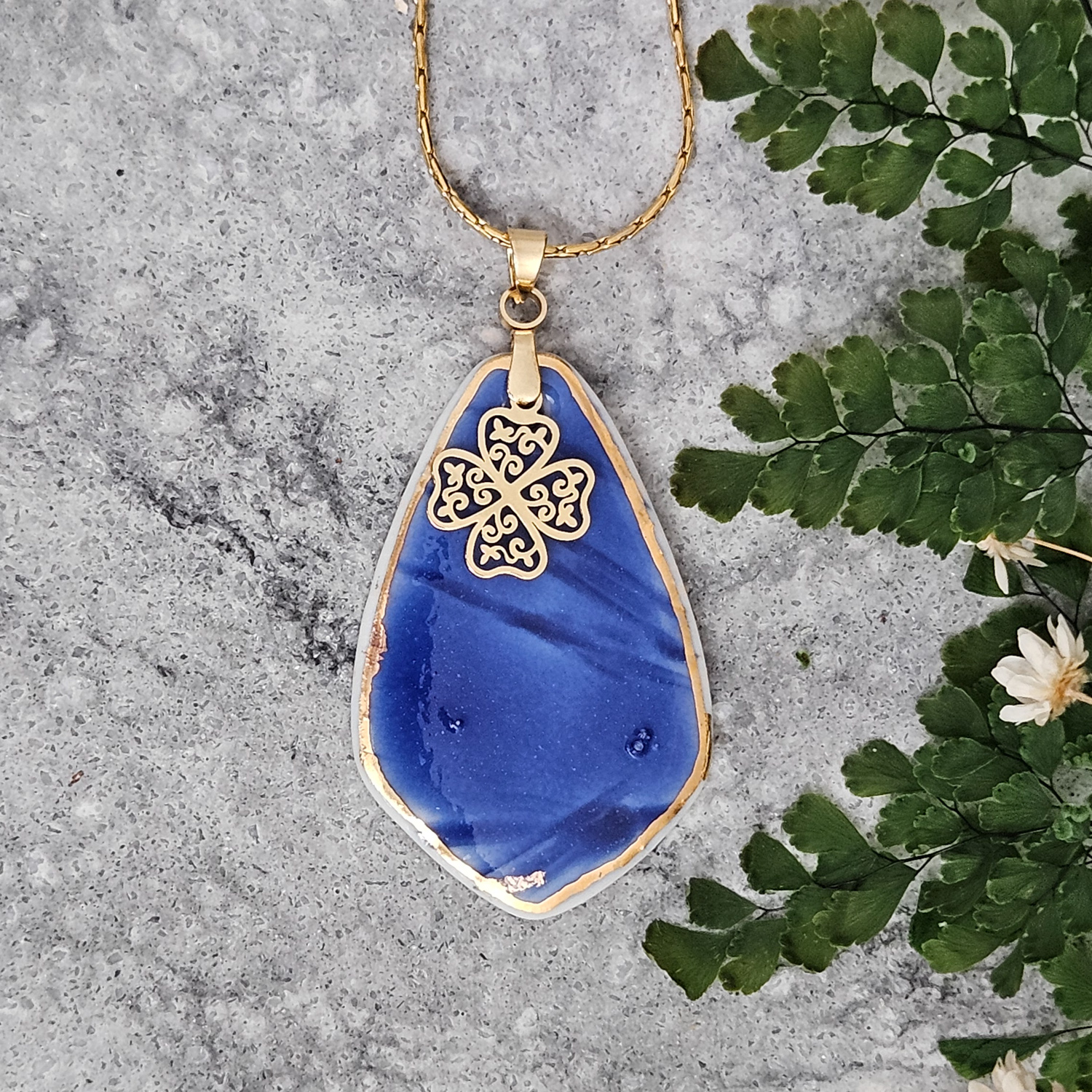 Cobalt blue fine ceramic porcelain designer necklace - embossed plant with 22k gold plating and clover pendant