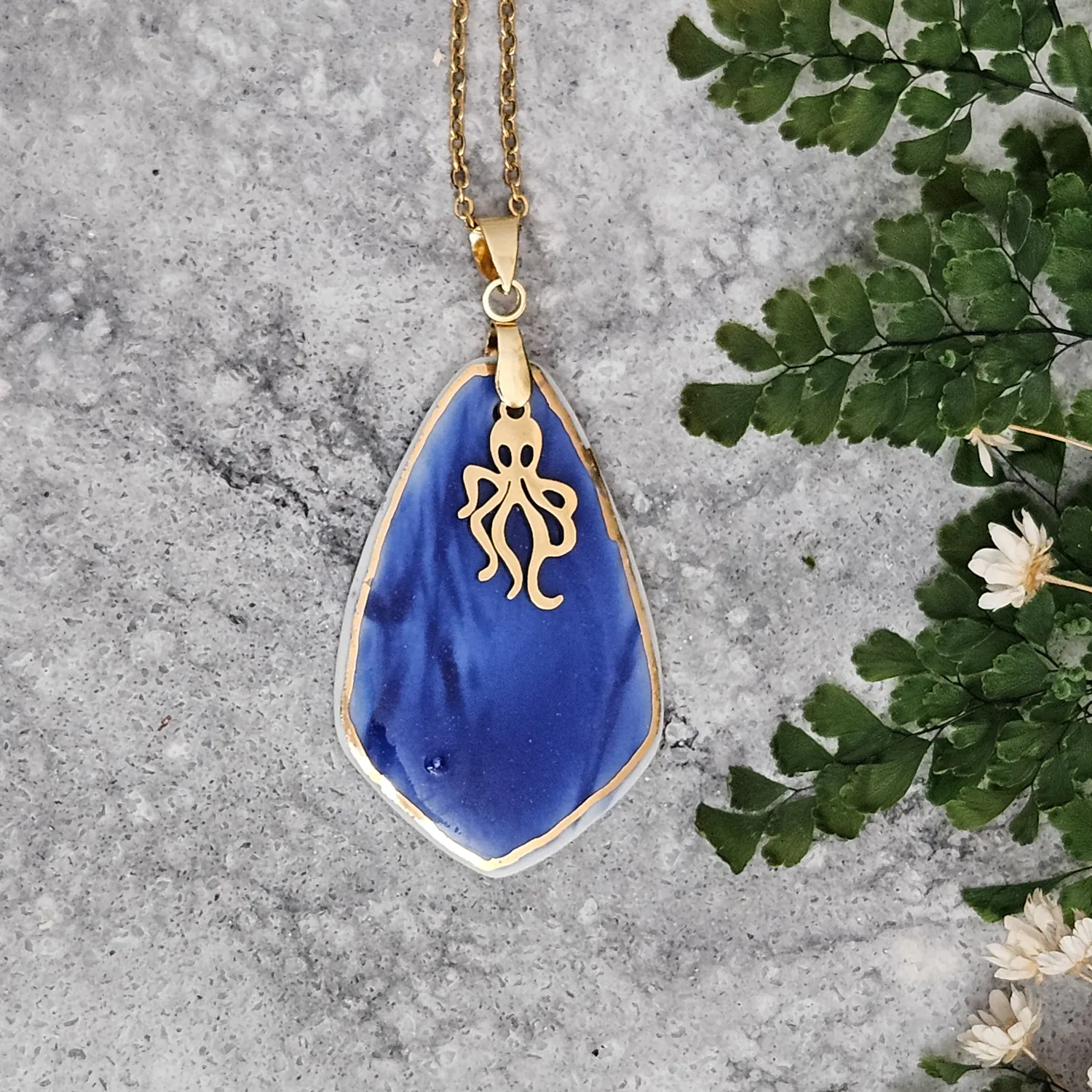 Cobalt blue fine ceramic porcelain designer necklace - embossed plant with 22k gold plating and octopus pendant