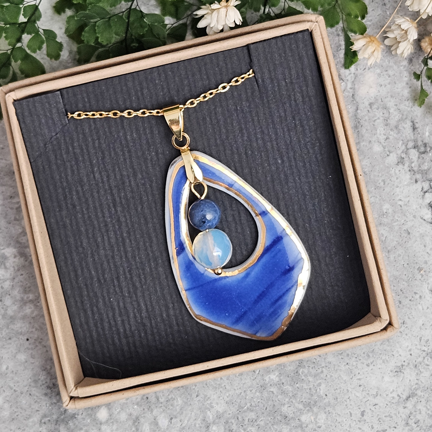 Cobalt blue fine ceramic porcelain designer necklace - embossed plant with 22k gold plating, dumortierite, and opal - Image 4