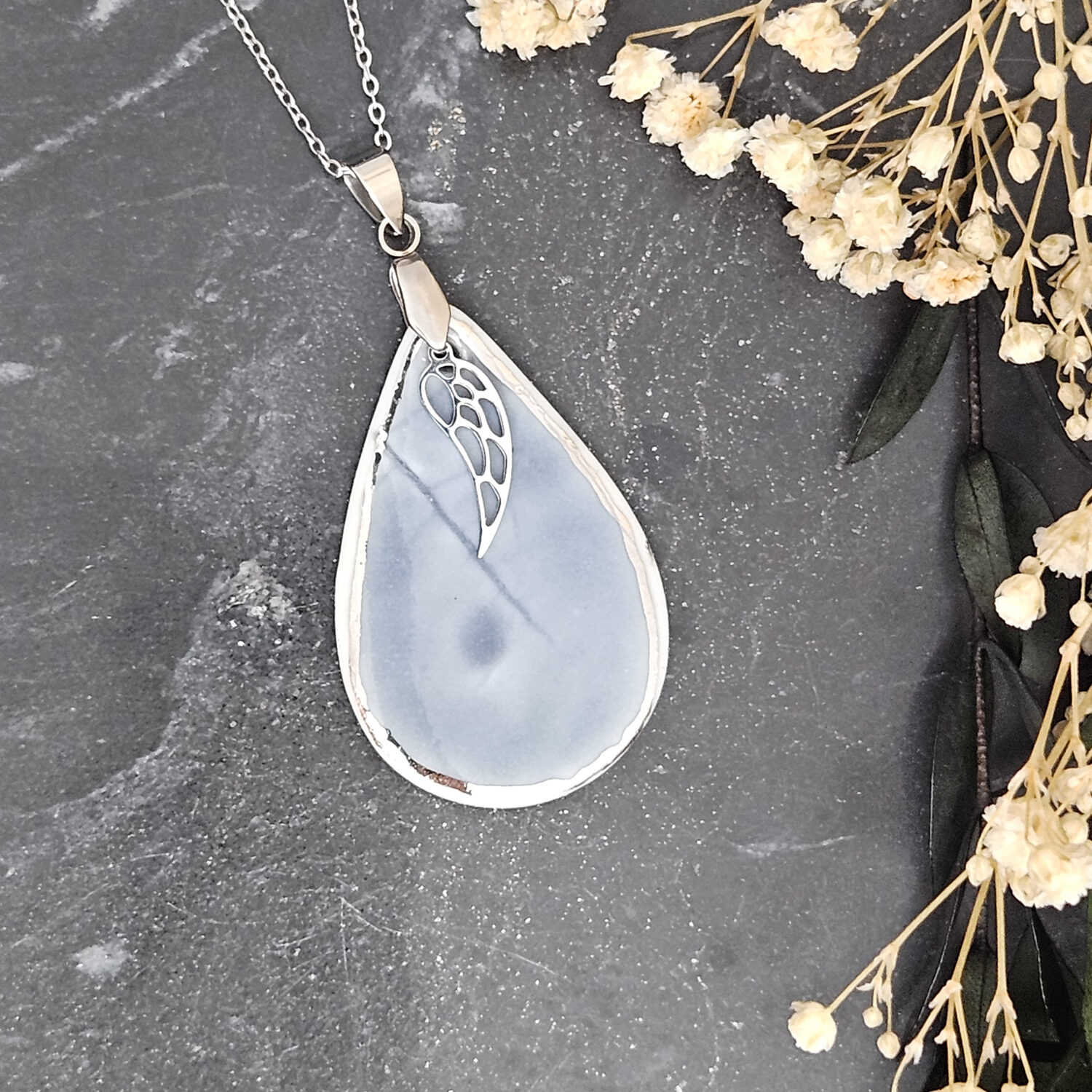Cobalt blue fine ceramic porcelain designer necklace - embossed plant with silver accents (white gold) and wing pendant