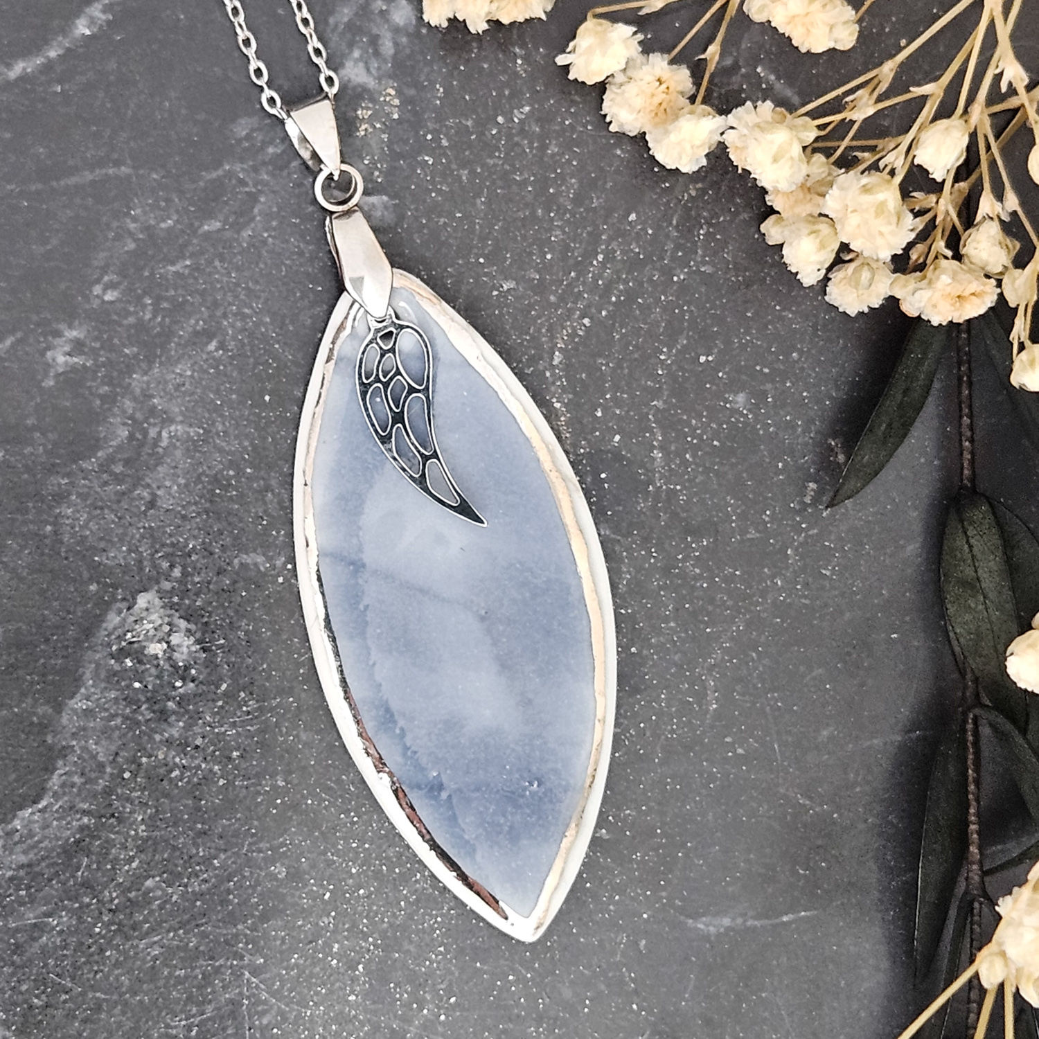 Cobalt blue fine ceramic porcelain designer necklace - embossed plant with silver accents (white gold) and wing pendant