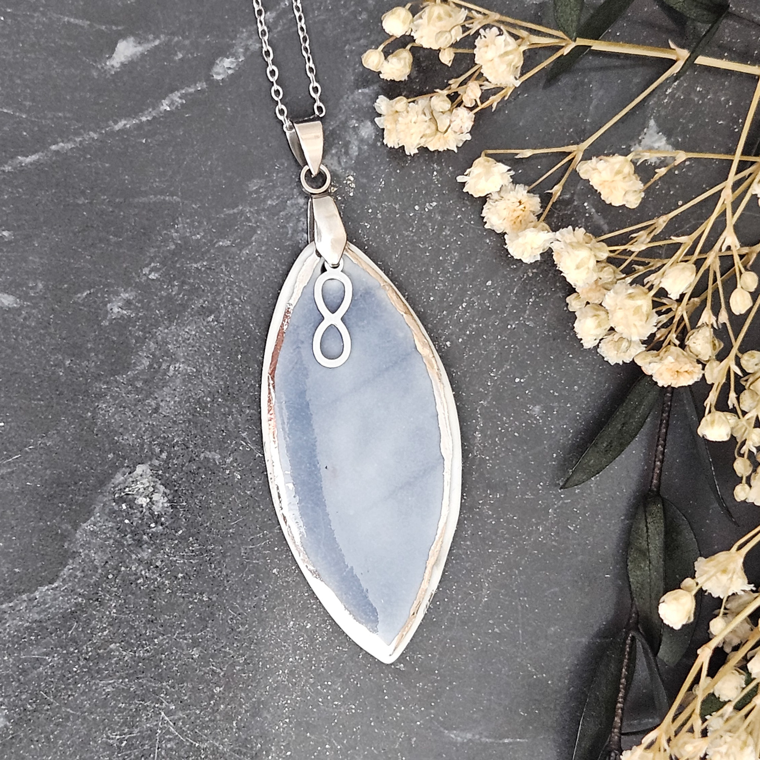 Cobalt blue fine ceramic porcelain designer necklace - embossed plant with silver accents (white gold) and infinity symbol pendant