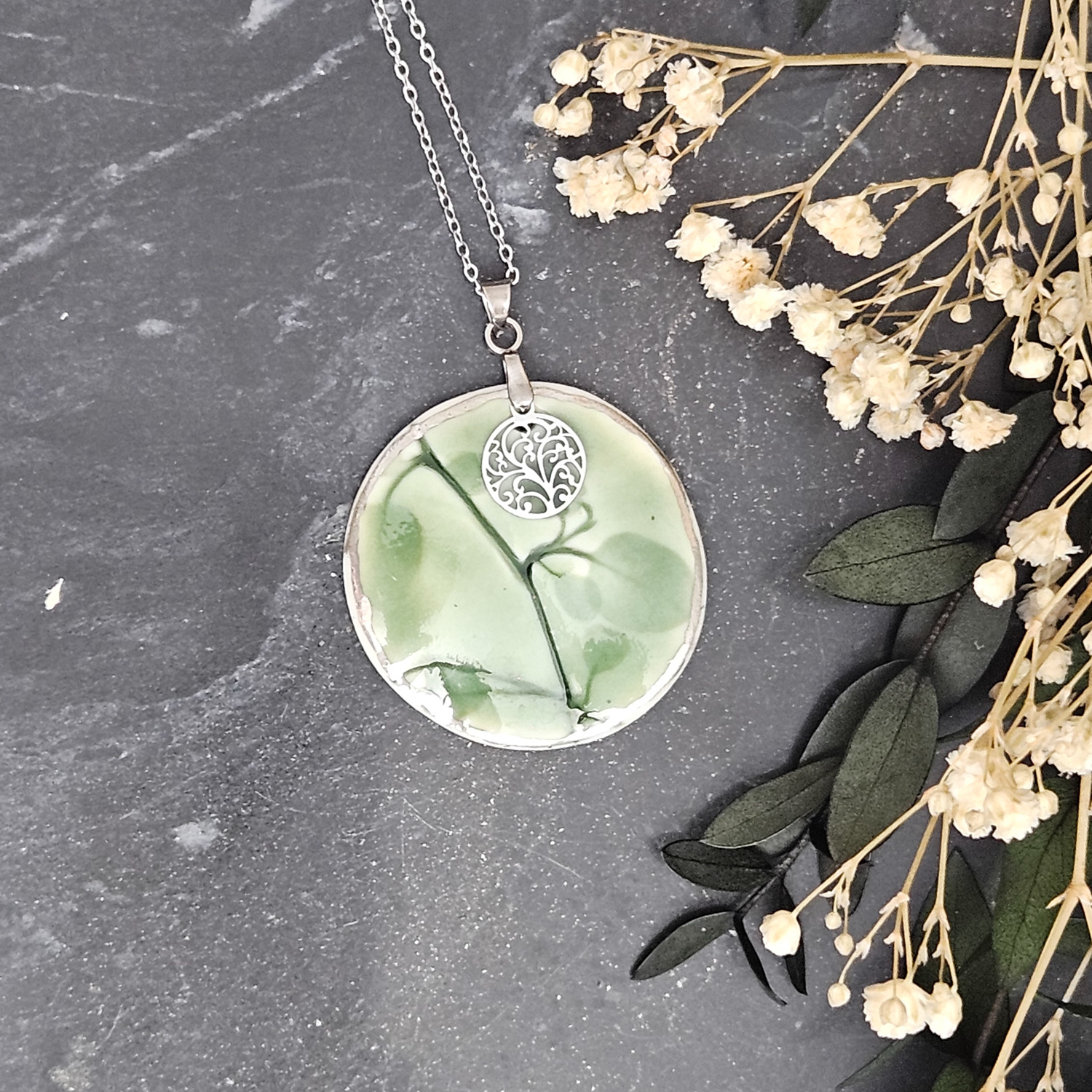 Emerald green fine ceramic porcelain designer necklace - embossed plant with silver accents (white gold) and round pendant with leaf pattern