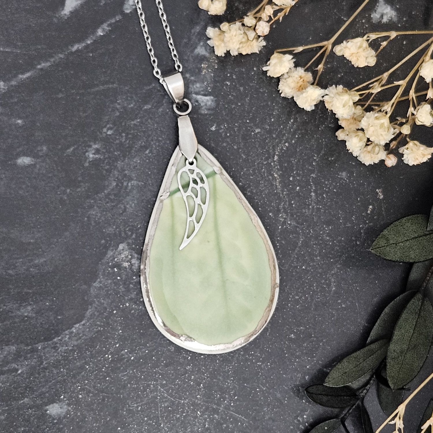 Emerald green fine ceramic porcelain designer necklace - embossed plant with silver accents (white gold) and wing pendant