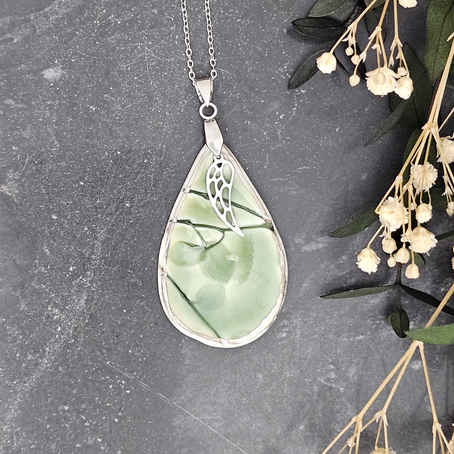 Emerald green fine ceramic porcelain designer necklace - embossed plant with silver accents (white gold) and wing pendant