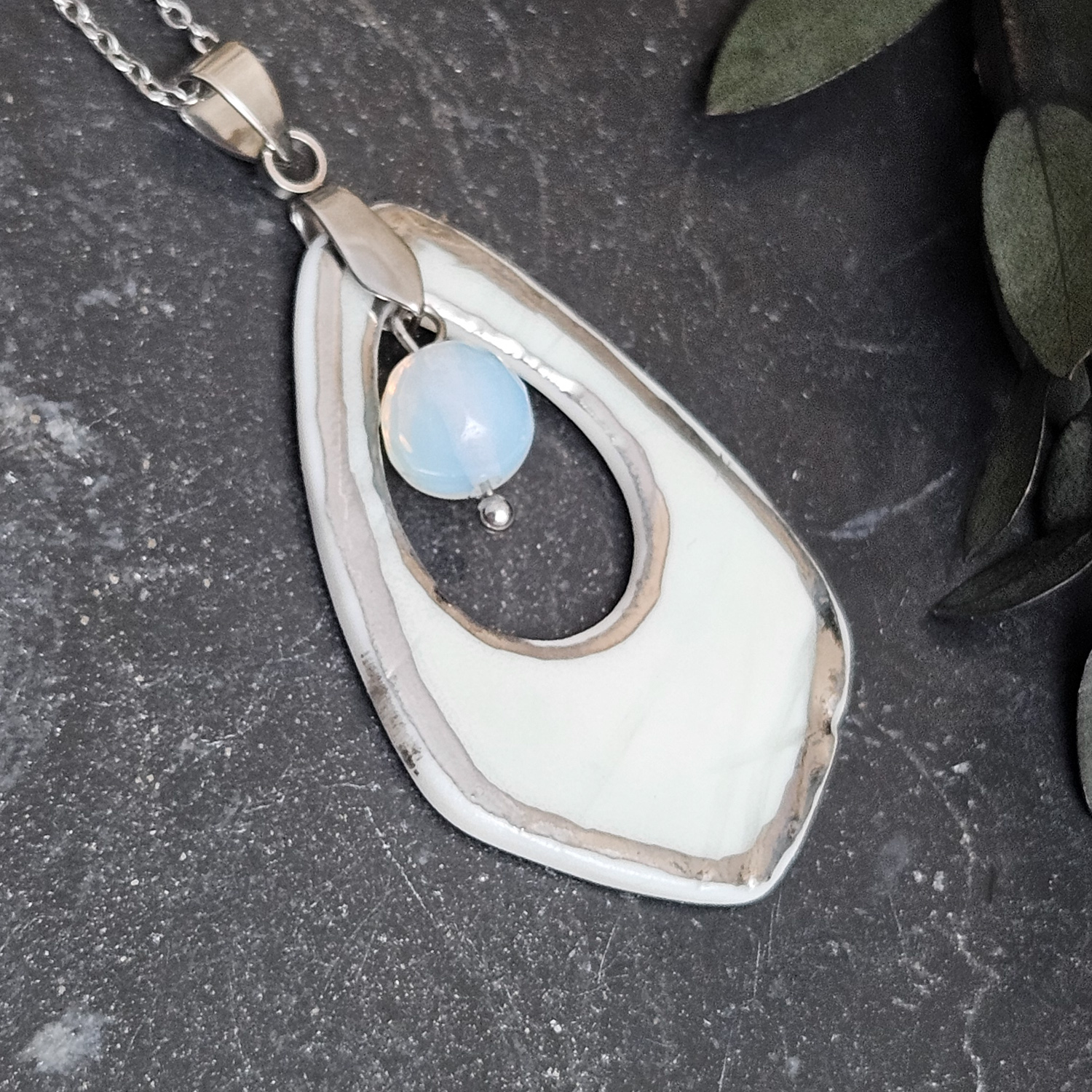 Light blue fine ceramic porcelain designer necklace - embossed plant with silver accents (white gold) and opal - obrazek 6