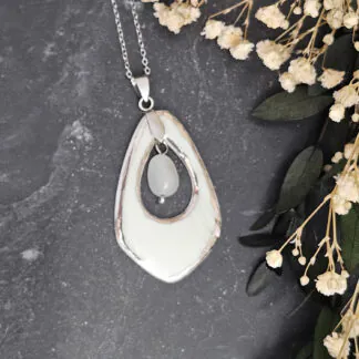 Light blue fine ceramic porcelain designer necklace - embossed plant with silver accents (white gold) and moonstone