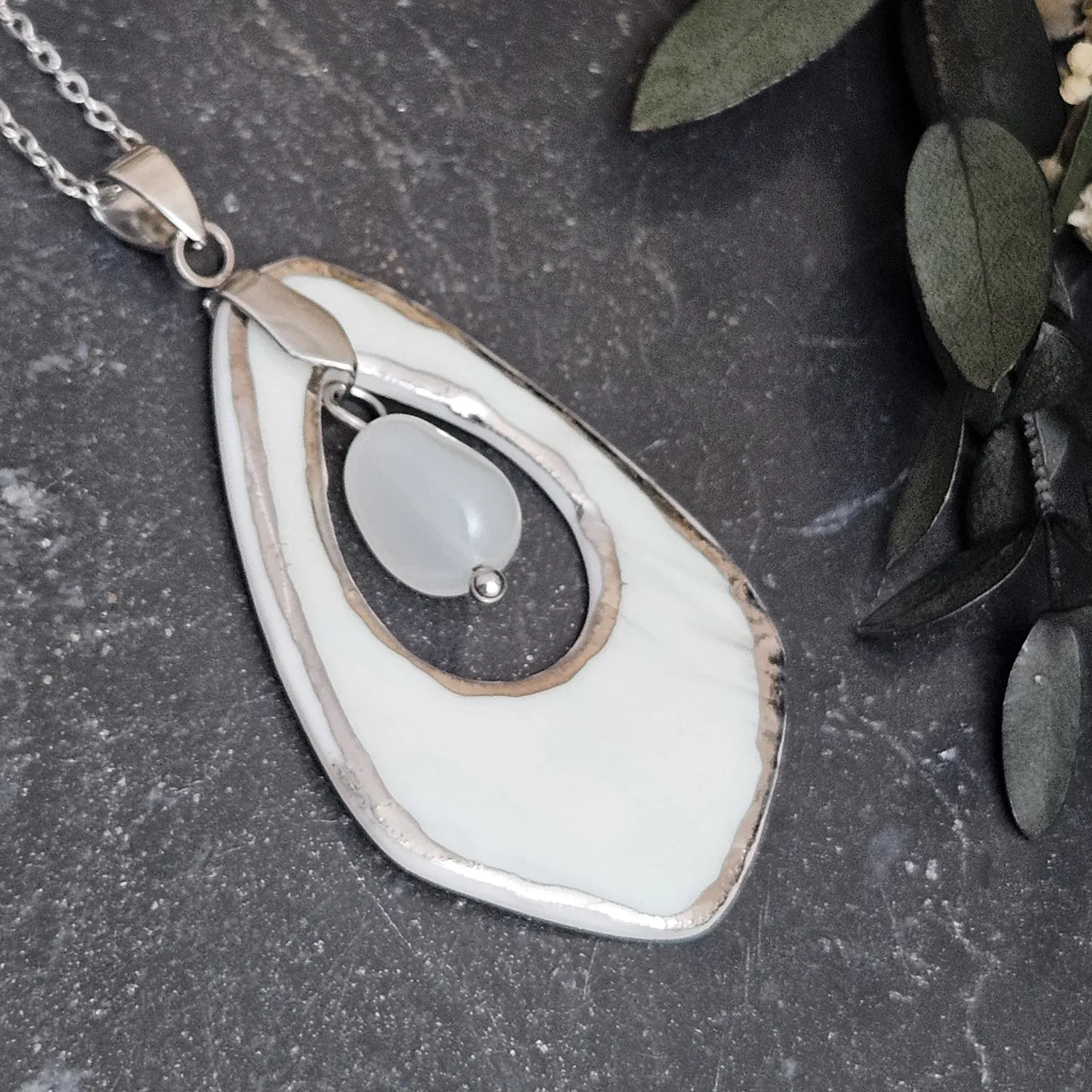 Light blue fine ceramic porcelain designer necklace - embossed plant with silver accents (white gold) and moonstone - Image 2
