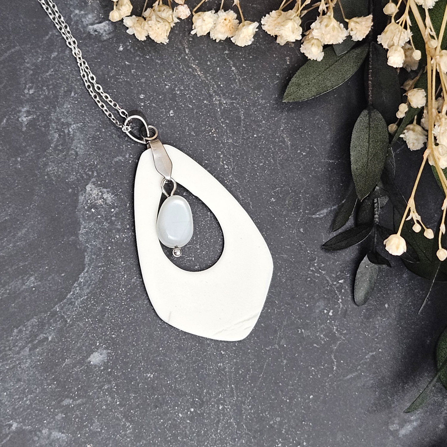 Light blue fine ceramic porcelain designer necklace - embossed plant with silver accents (white gold) and moonstone - obrazek 3