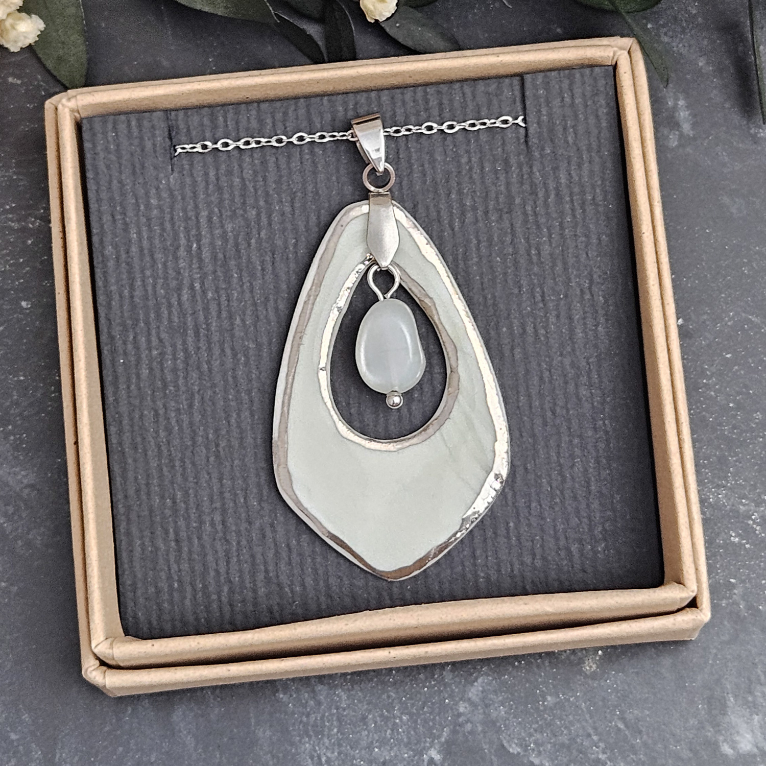 Light blue fine ceramic porcelain designer necklace - embossed plant with silver accents (white gold) and moonstone - obrazek 4