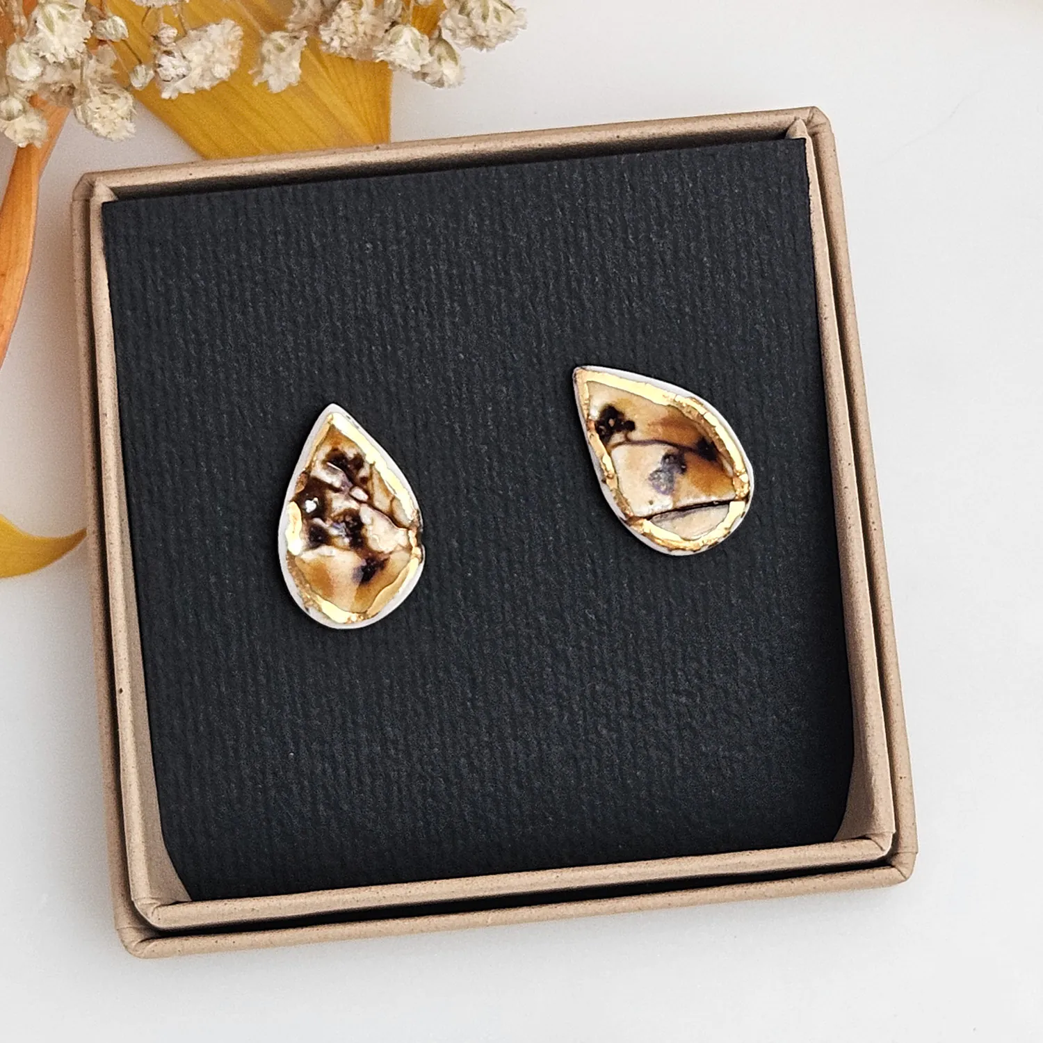 Amber fine ceramic porcelain hypoallergenic stud designer earrings for sensitive ears with 22k gold plating - embossed plant - Image 4
