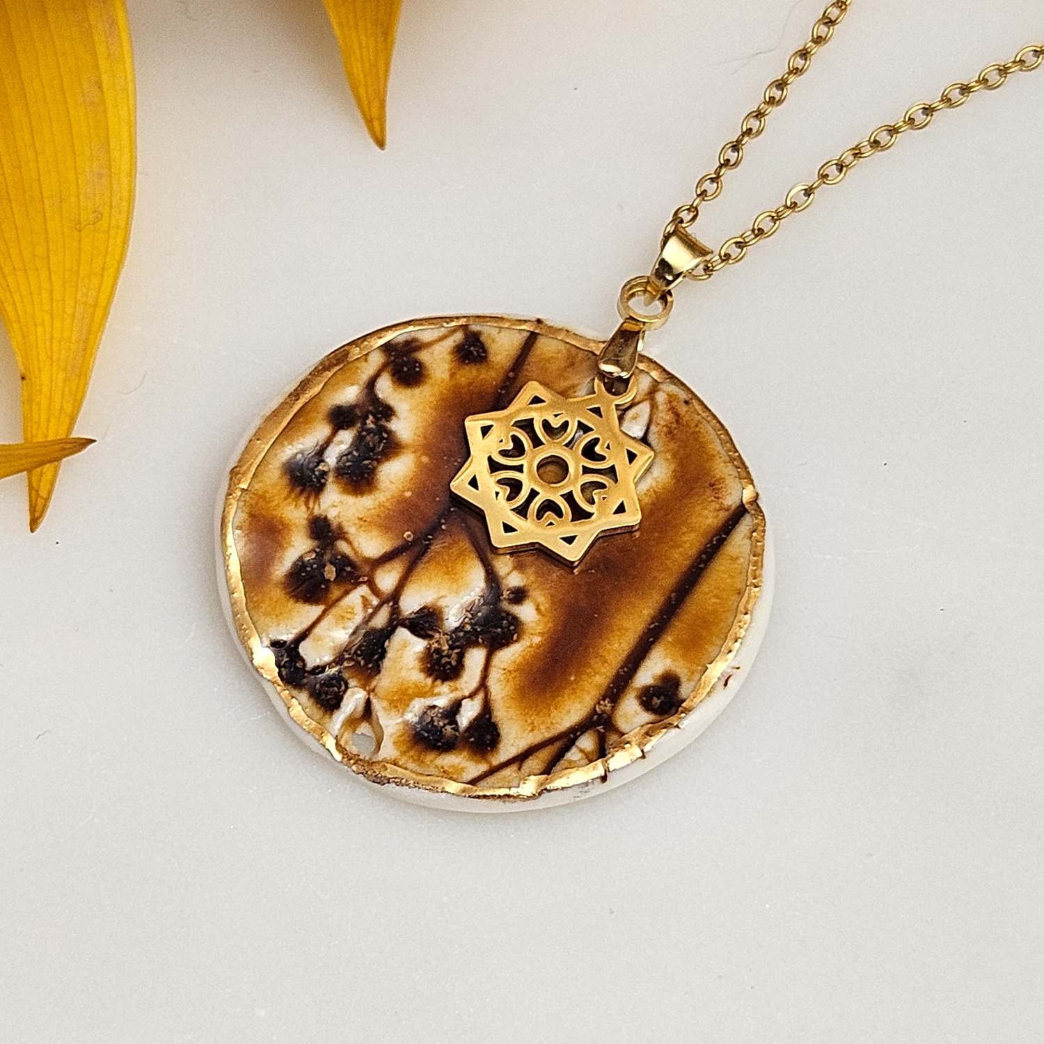 Amber fine ceramic porcelain designer necklace - embossed plant with 22k gold plating and star pendant - Image 2