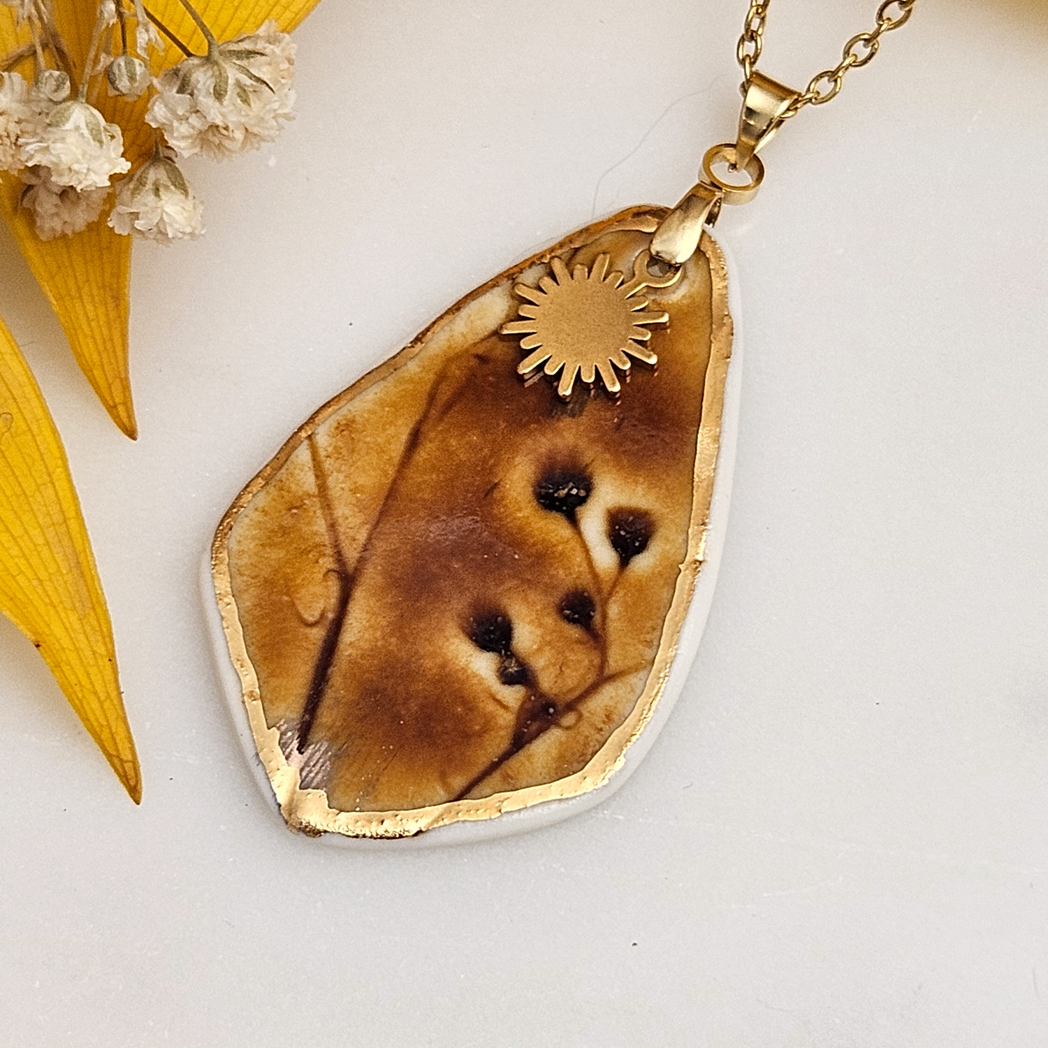 Amber fine ceramic porcelain designer necklace - embossed plant with 22k gold plating and sun pendant - Image 2