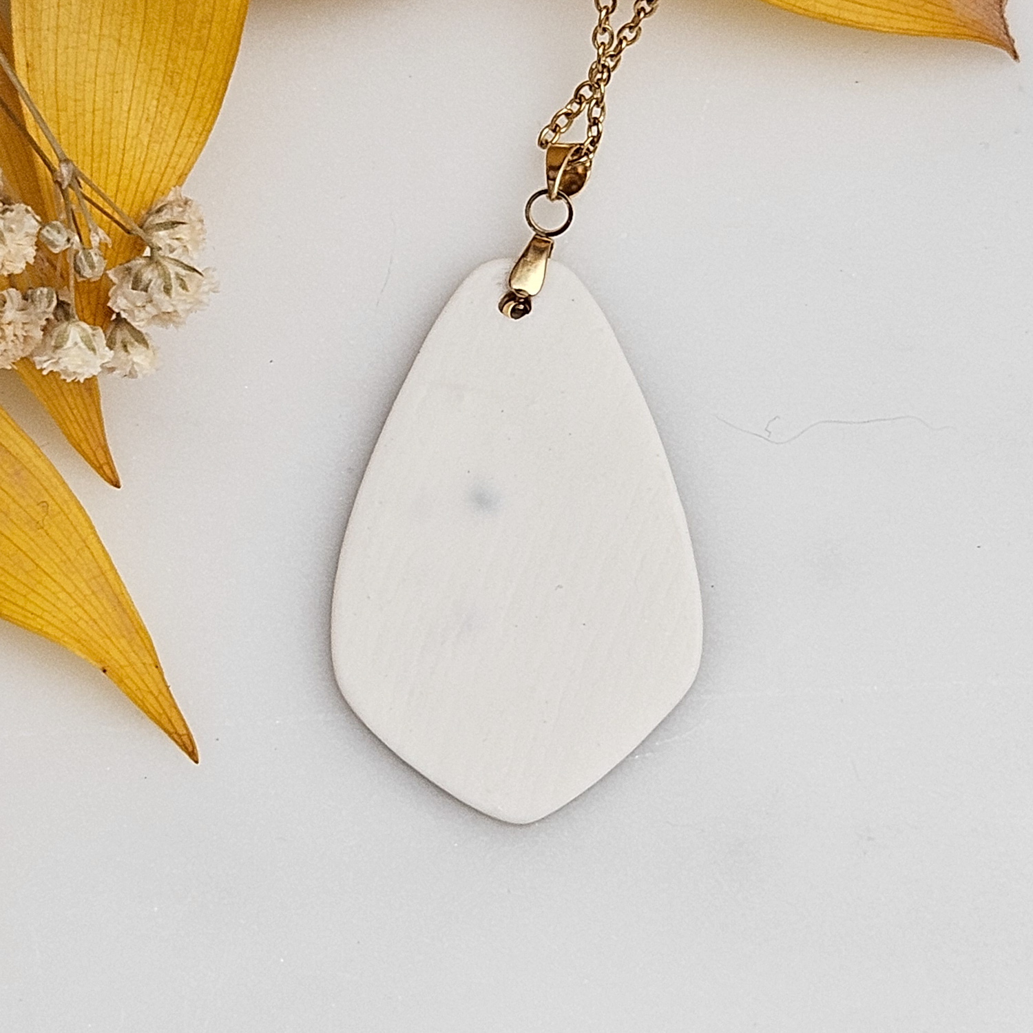Amber fine ceramic porcelain designer necklace - embossed plant with 22k gold plating and sun pendant - Image 3