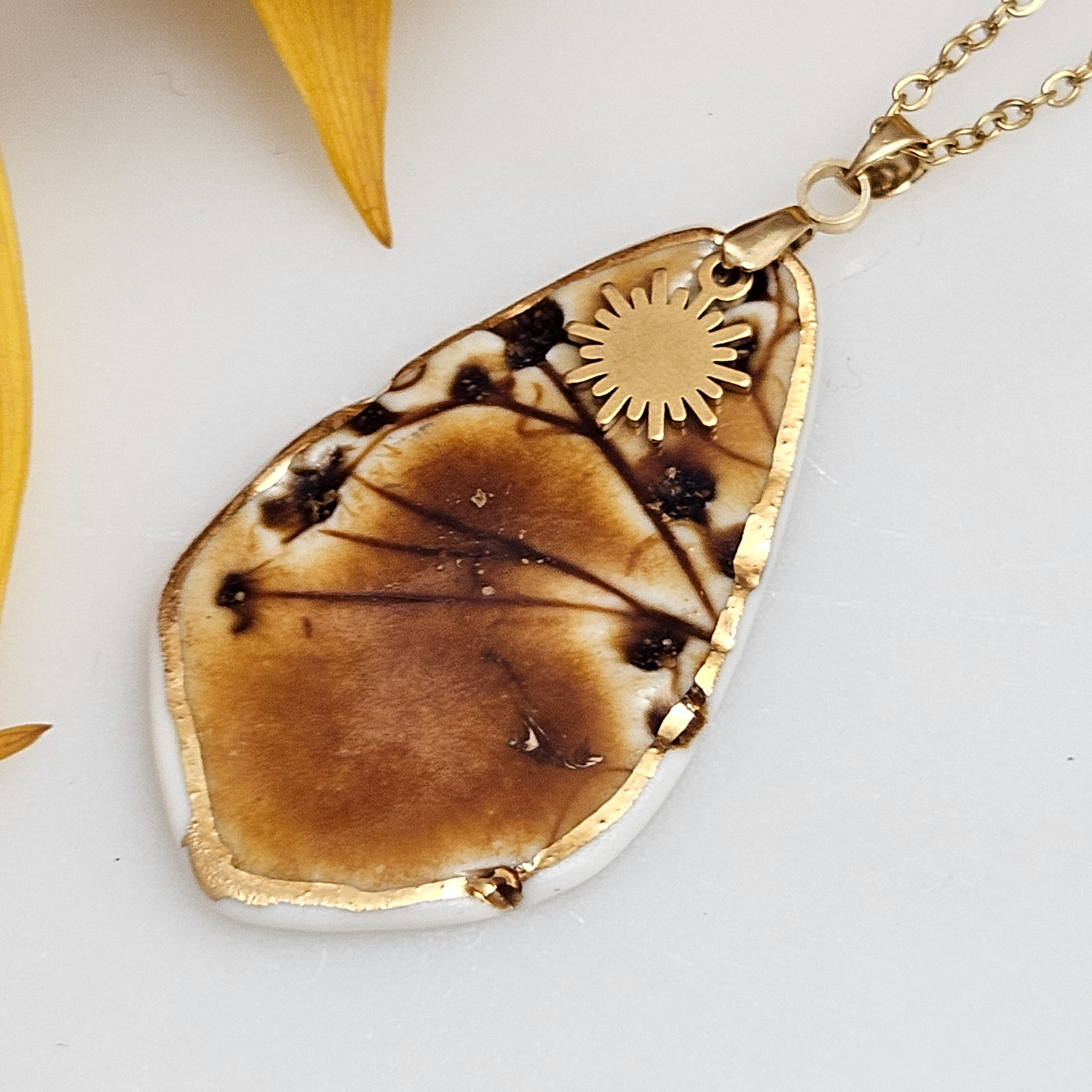 Amber fine ceramic porcelain designer necklace - embossed plant with 22k gold plating and sun pendant - Image 2