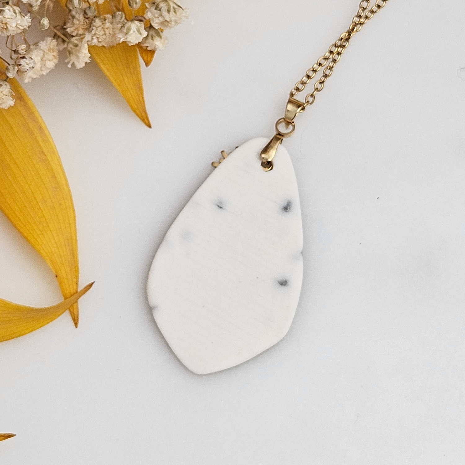 Amber fine ceramic porcelain designer necklace - embossed plant with 22k gold plating and sun pendant - Image 3