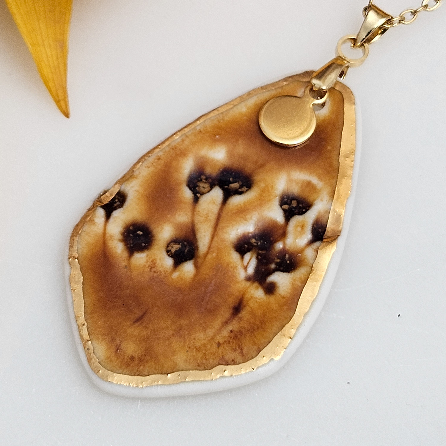 Amber fine ceramic porcelain designer necklace - embossed plant with 22k gold plating and round pendant - Image 2
