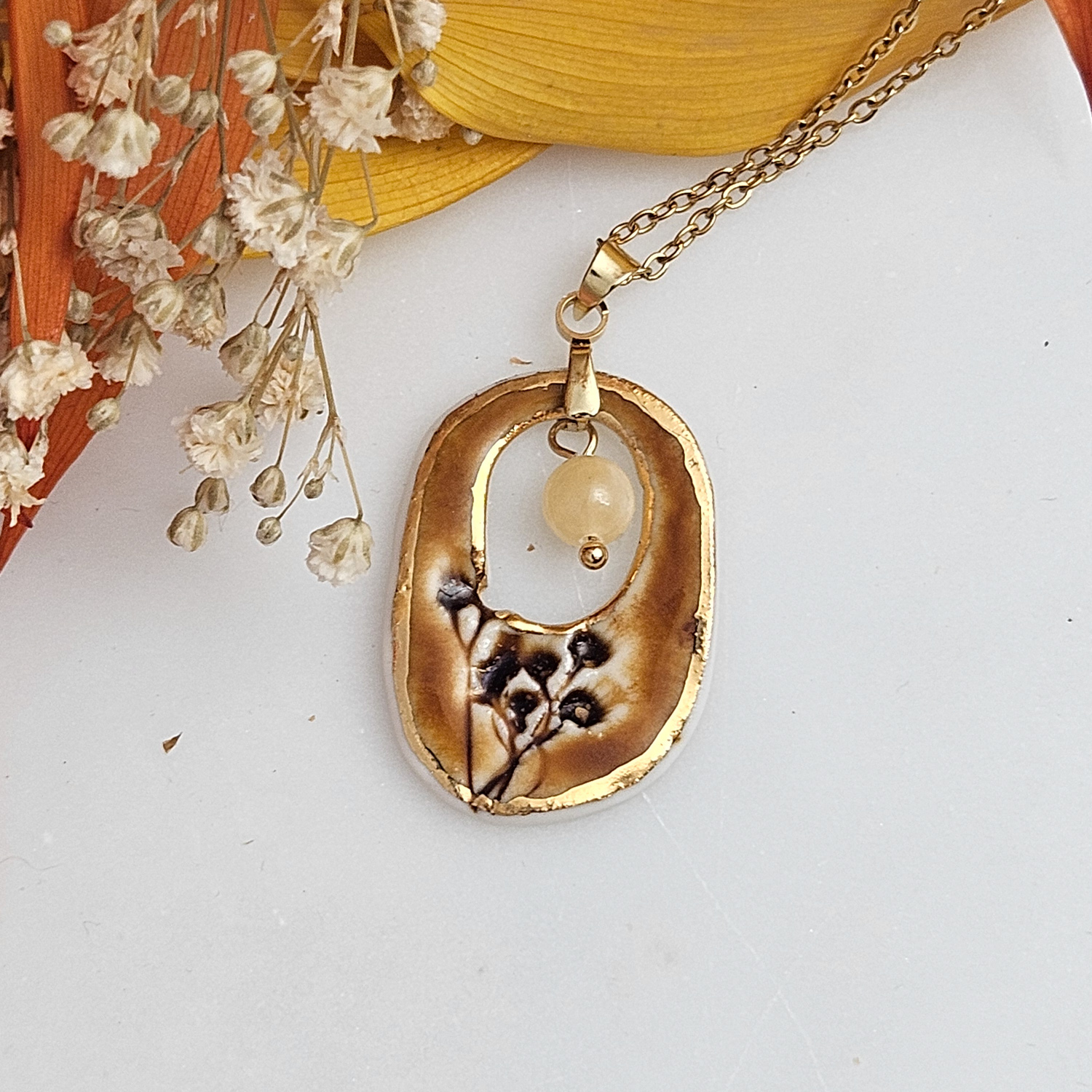 Amber fine ceramic porcelain designer necklace - embossed plant with 22k gold plating and amber nephrite